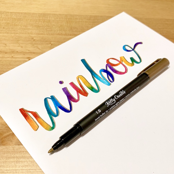 Pretty rainbow hand lettering and calligraphy using brush pens and water for a blending effect www.kellycreates.ca