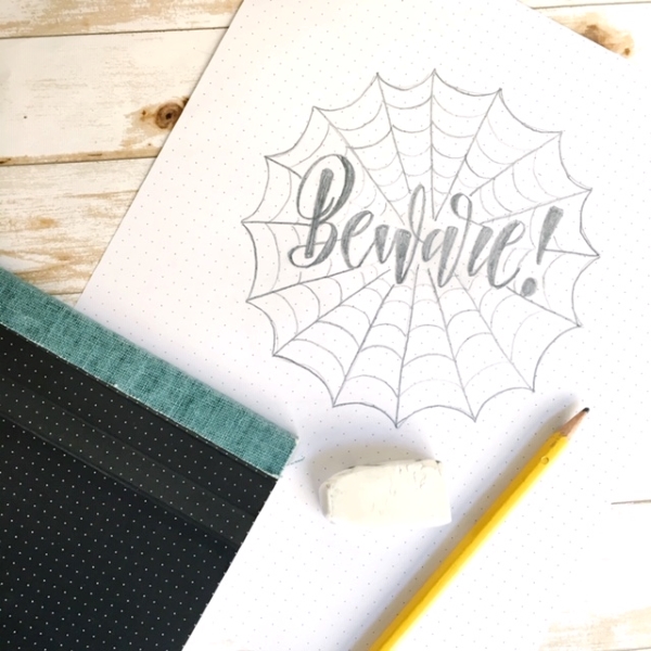 Super tutorial for Halloween hand lettering inside spider webs www.kellycreates.ca